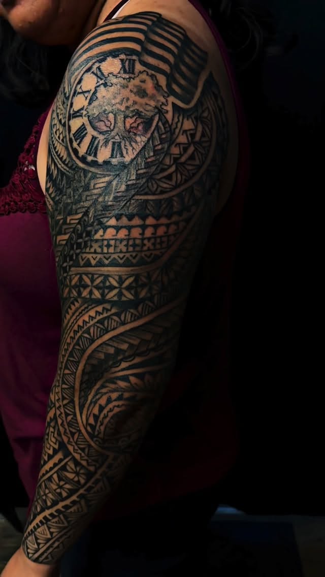 Bold Polynesian Tongan tatau sleeve with intricate blackwork