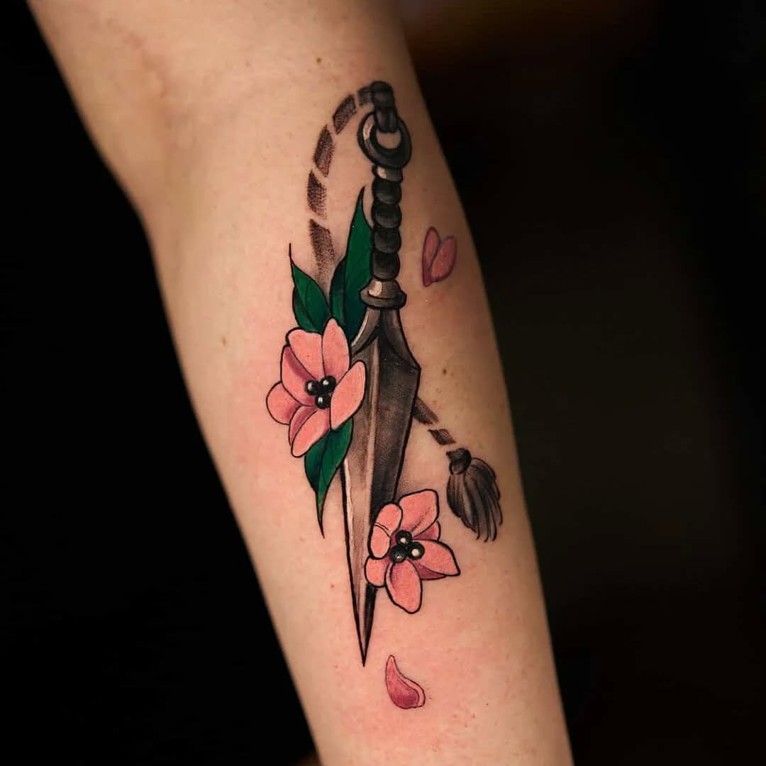 Neo-traditional dagger pierced by blooming pink sakura petals