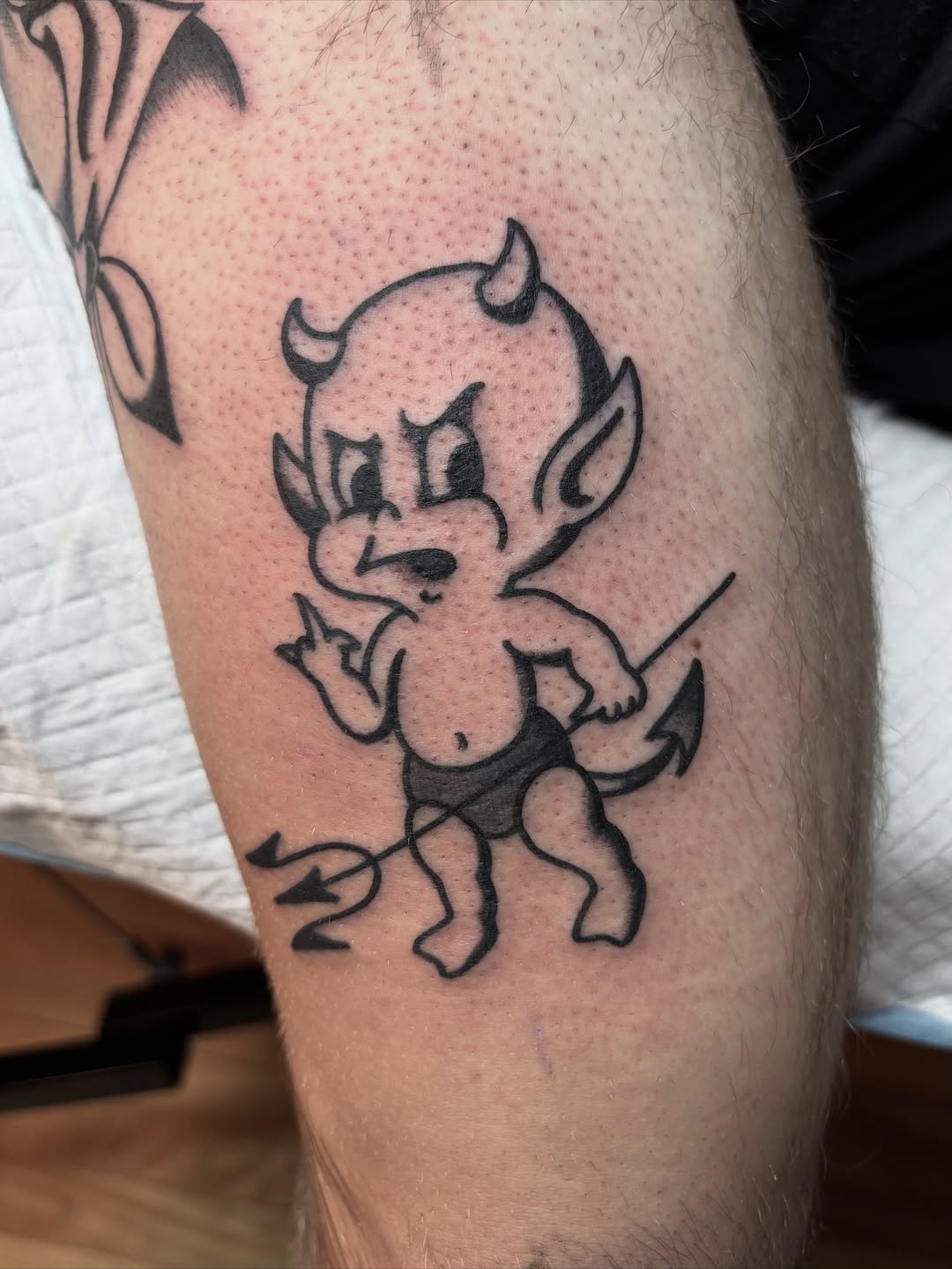 Playful demon cartoon with bold outlines and minimal shading