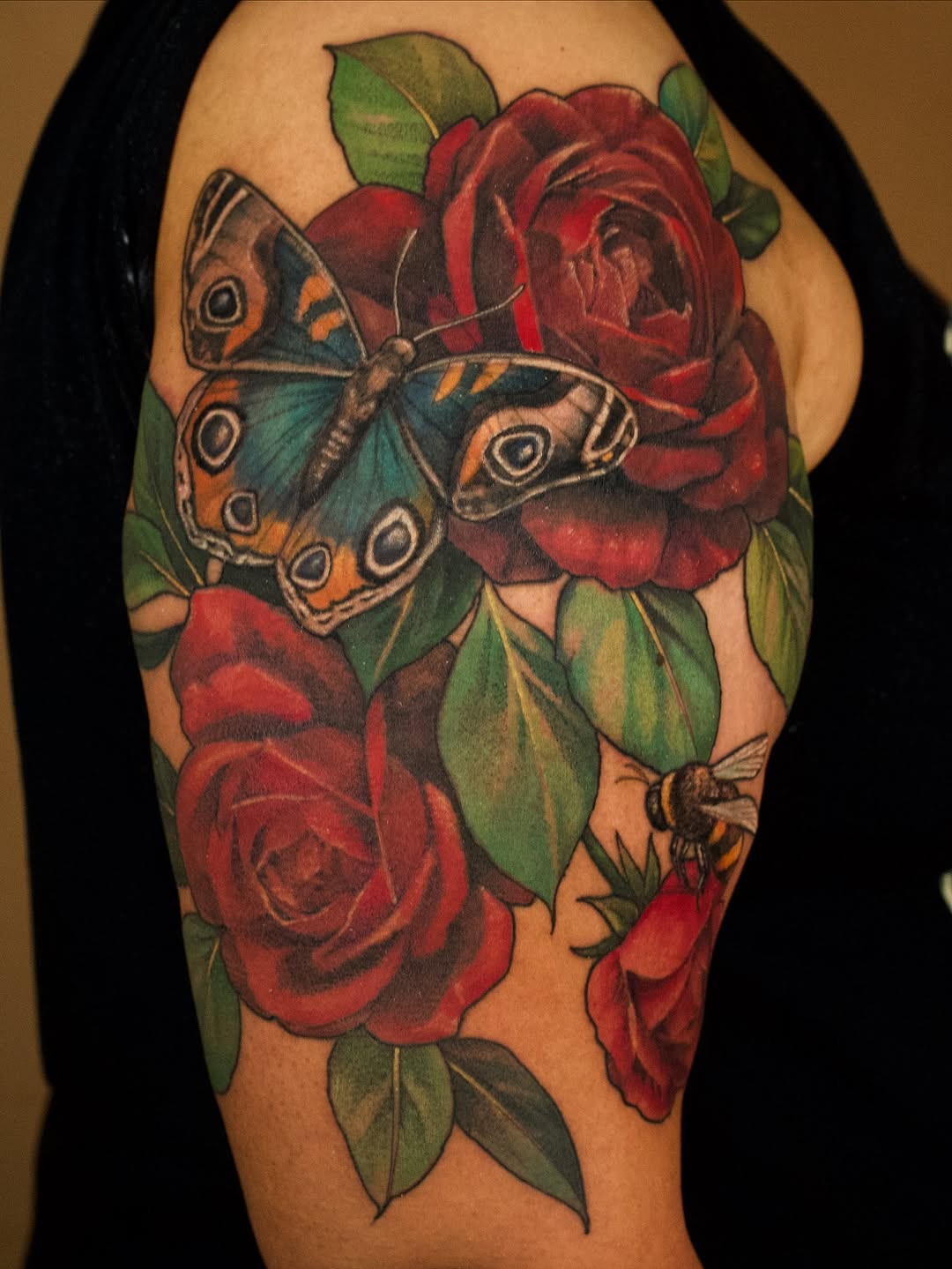 Vivid neo-traditional bouquet with bold butterfly centerpiece