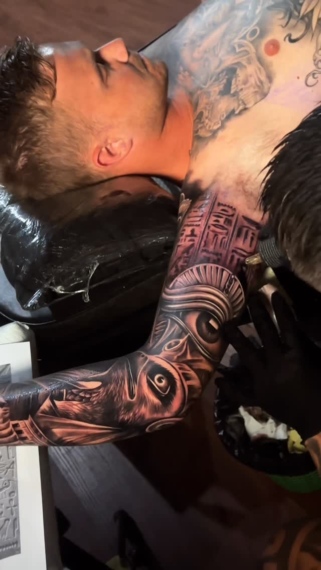 Monumental black-and-gray animal portrait with architectural motifs