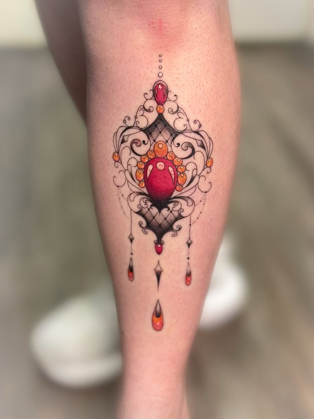 Luxurious ornamental jewel motif with delicate filigree and gems.