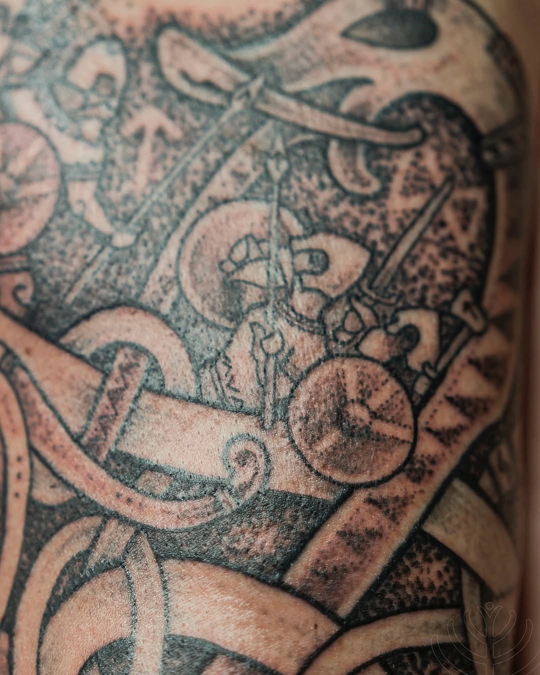 Intricate blackwork sleeve segment with ornate scrolls and dotwork