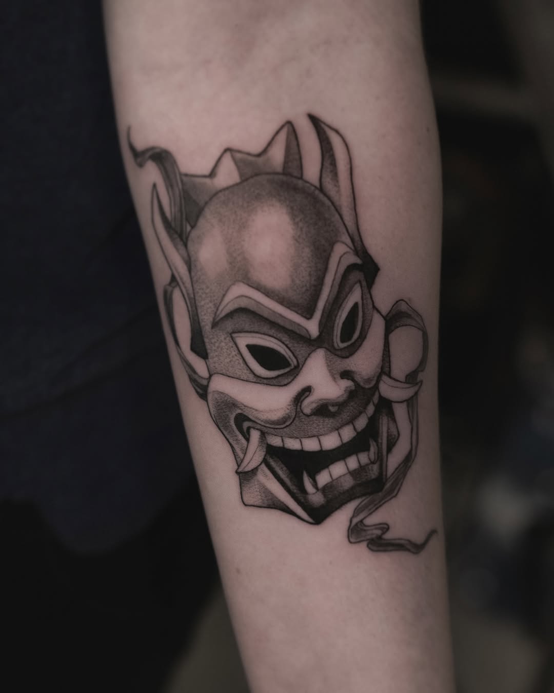 Menacing oni mask in bold blackwork with shading