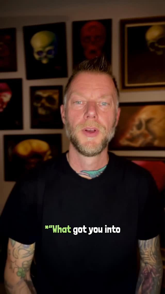 Portrait of tattooed man with colorful sleeves and skull art