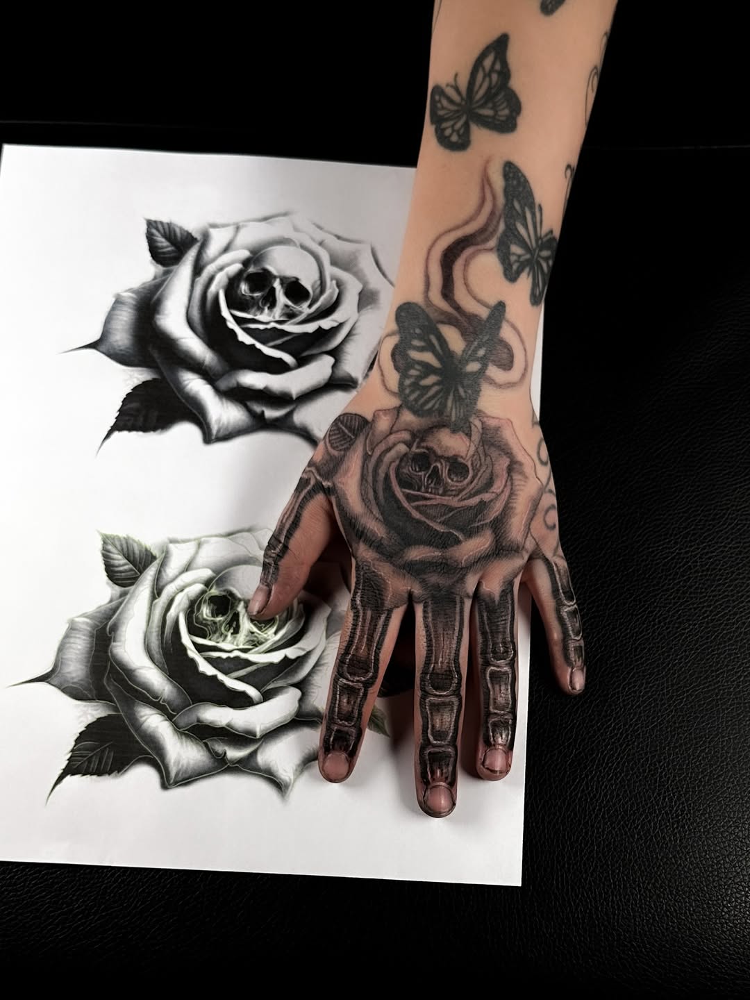 Monochrome rose with skull centerpiece, bold shading.