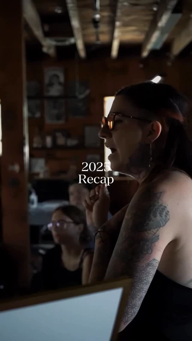 Sleek blackwork floral-geometric sleeve along forearm