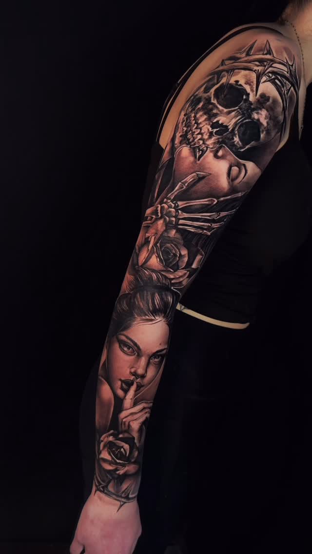 Dark grayscale outer sleeve with skull, roses, and portrait