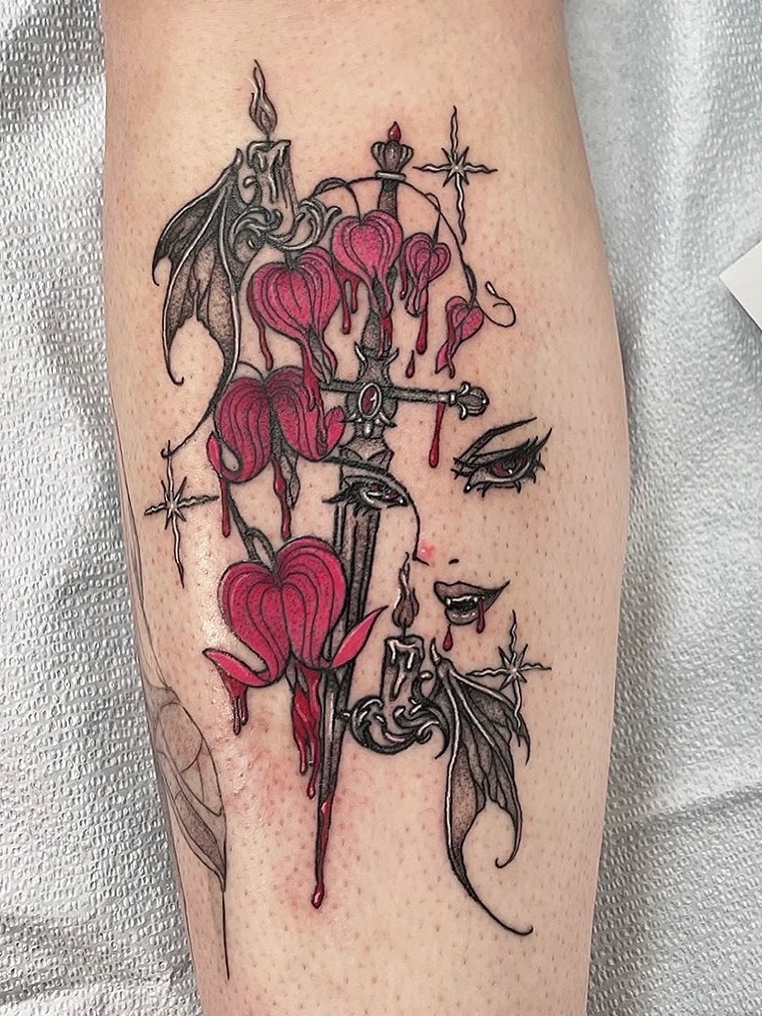 Neo-traditional bleeding-heart florals with dagger and wings