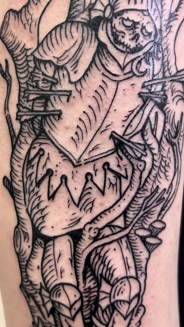 Bold blackwork, surreal skull-and-crown anatomy with sharp lines.