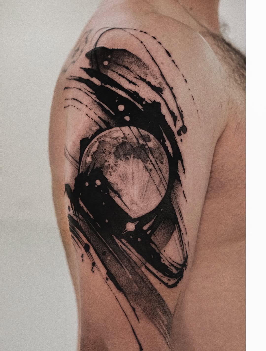 Bold abstract black circle with sweeping brush strokes