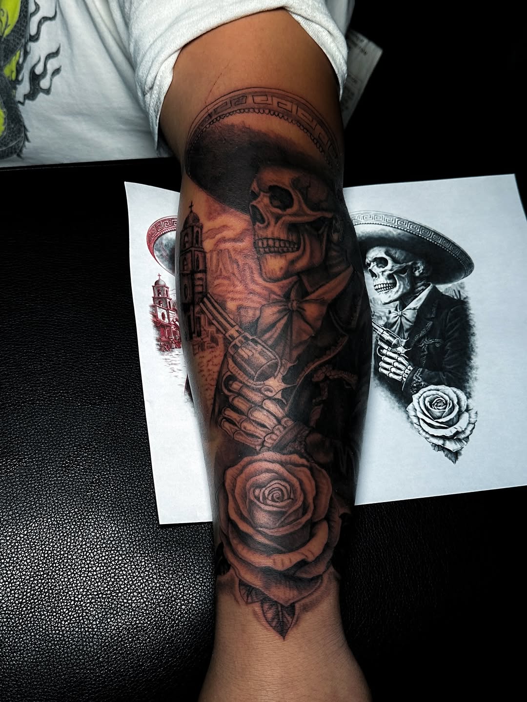 Dark skull-charro portrait with rose, bold black-and-gray shading