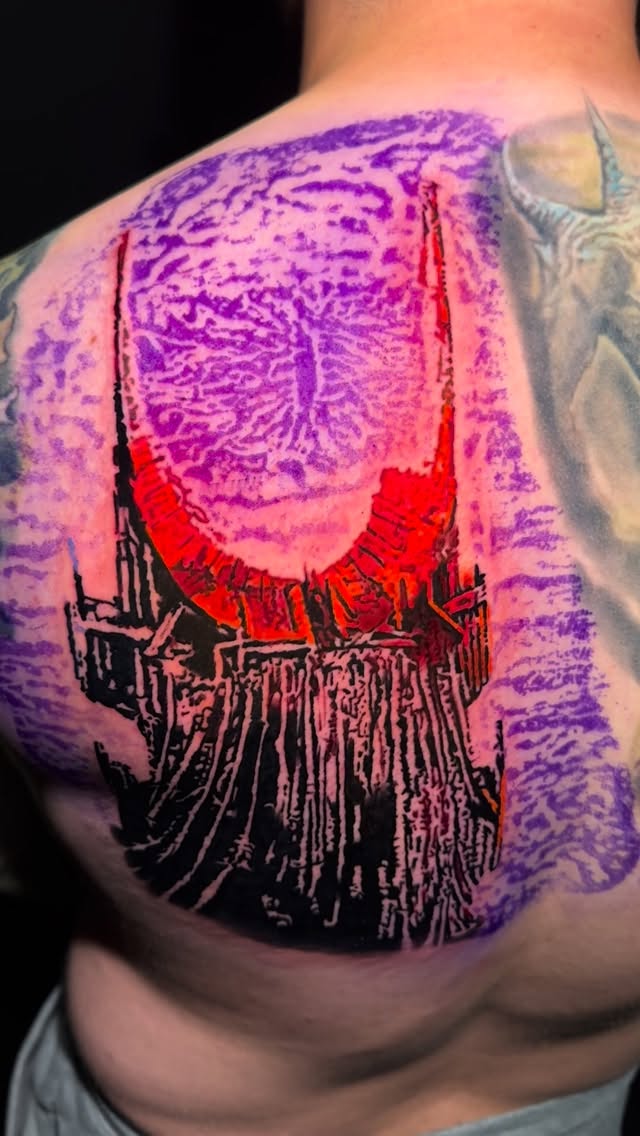 Vivid Eye of Sauron over jagged fortress silhouette