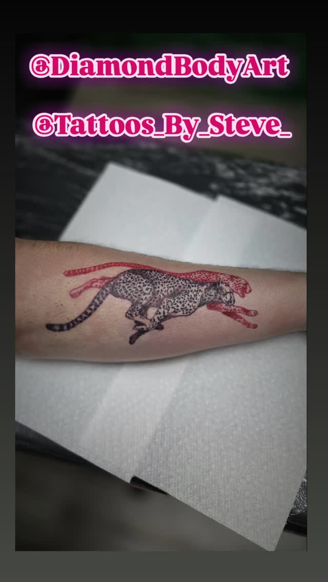 Dynamic cheetah in sprint with red flowing accents