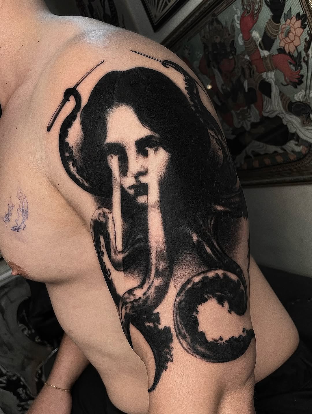 Monochrome female portrait with a wrapping serpent