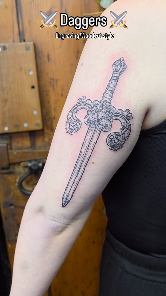Ornate dagger with woodcut engraving on upper arm