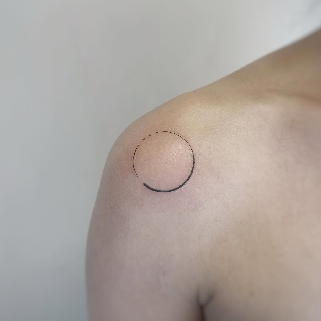 Delicate minimalist circular linework with dot accents