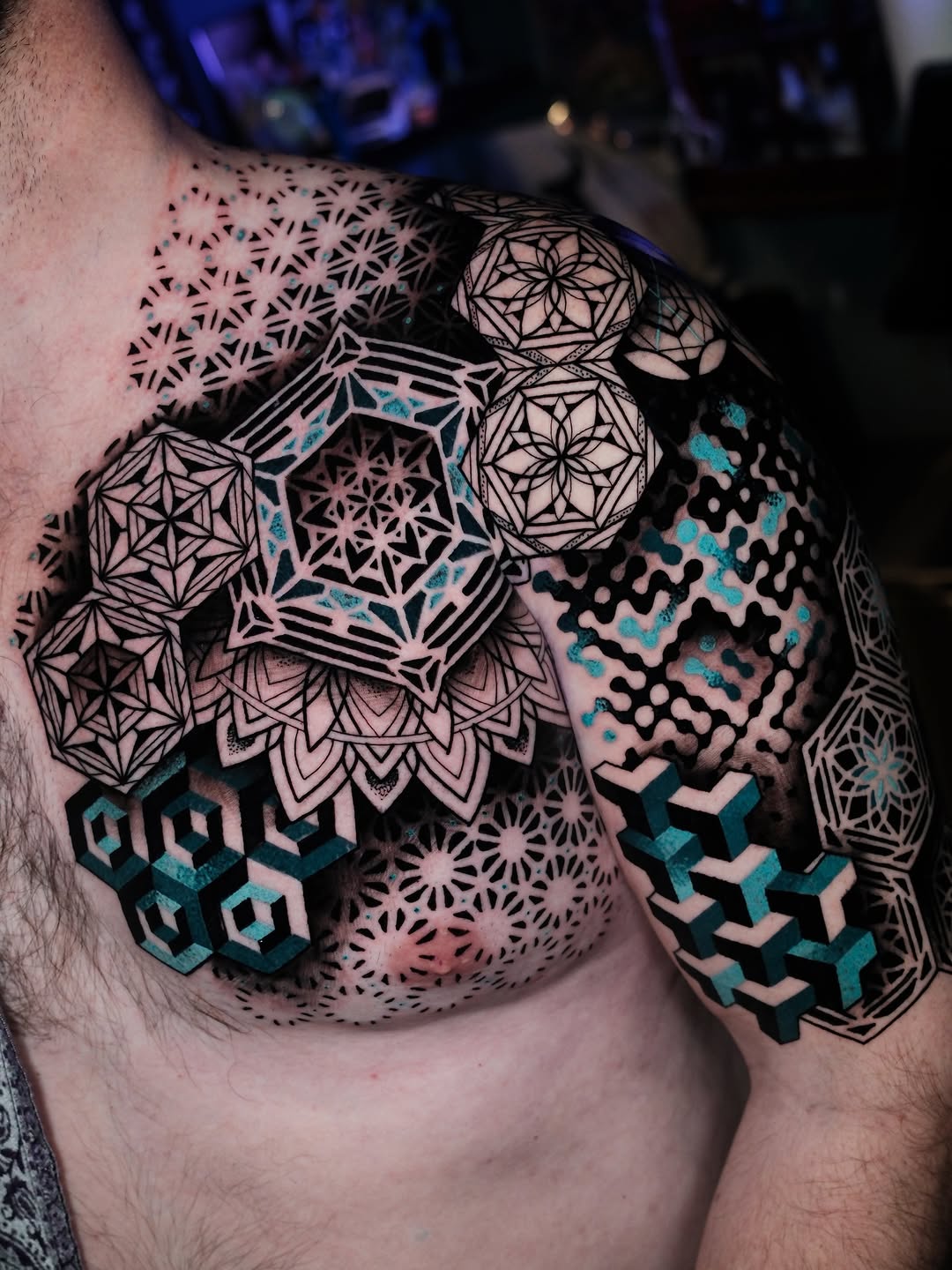 Intricate geometric tessellations with bold black linework and turquoise accents