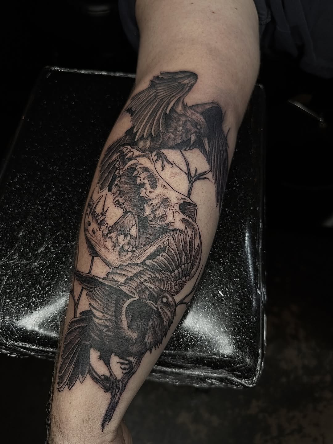 Somber black-and-gray raven memorial for Odin the dog