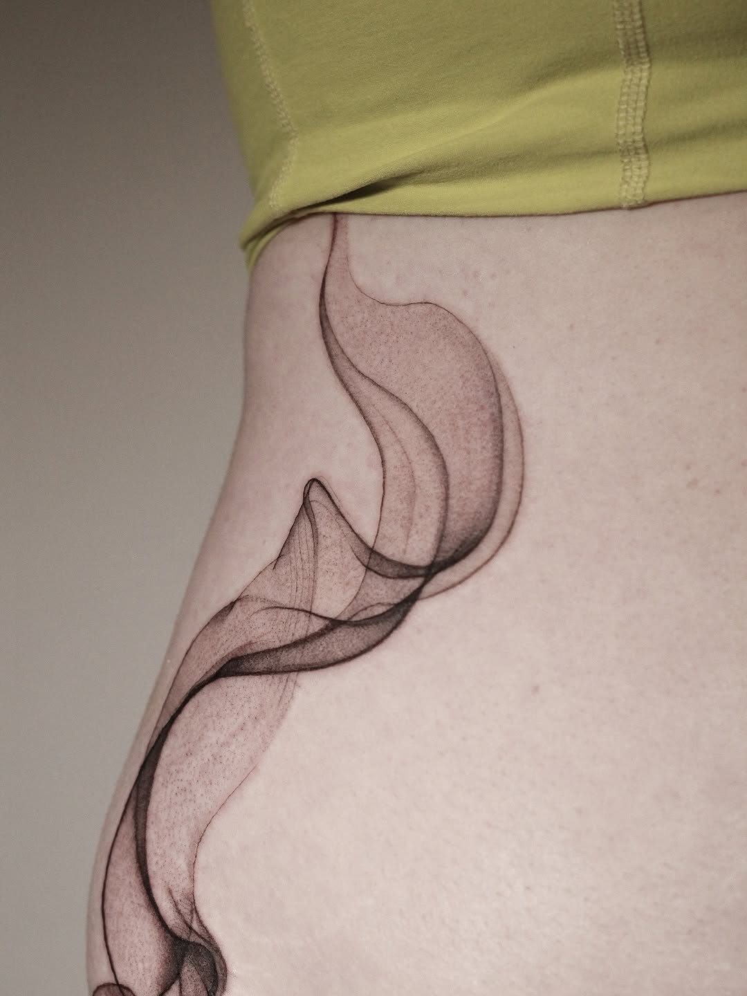 Elegant, abstract smoke curves in fine black linework.