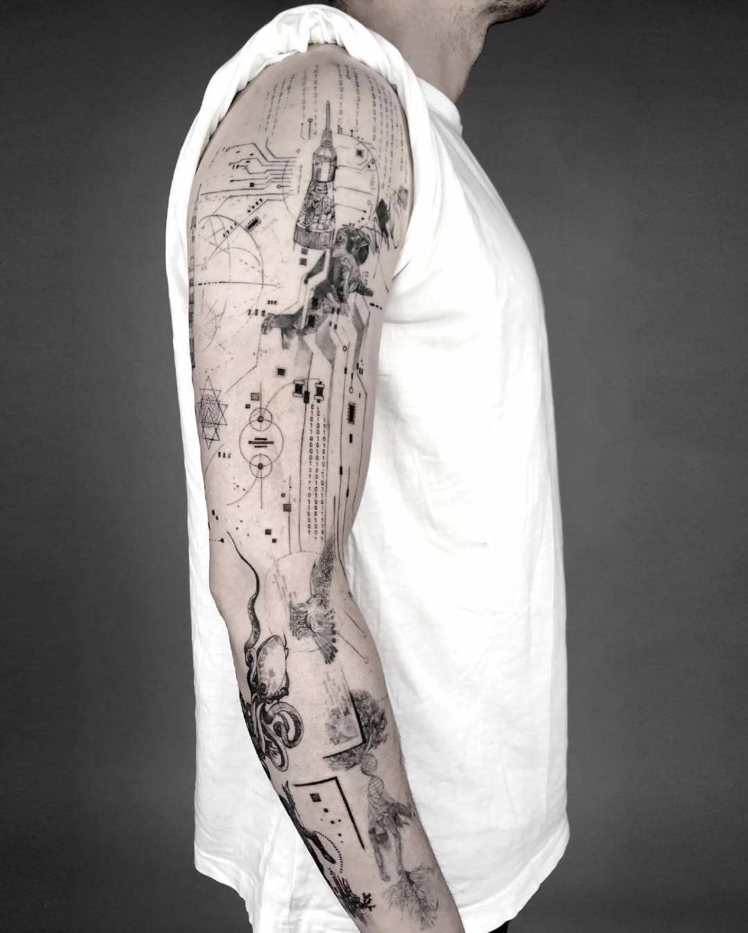 Intricate blackwork sleeve blending space motifs with geometric circuitry