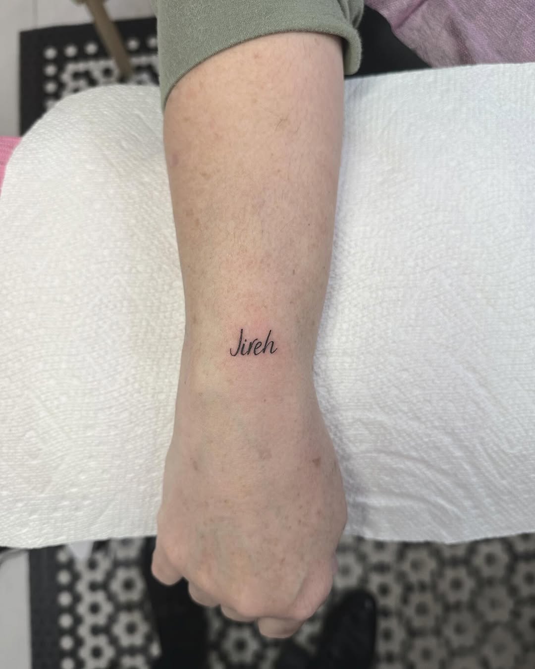 Elegant cursive 'Jireh' in fine-line script.