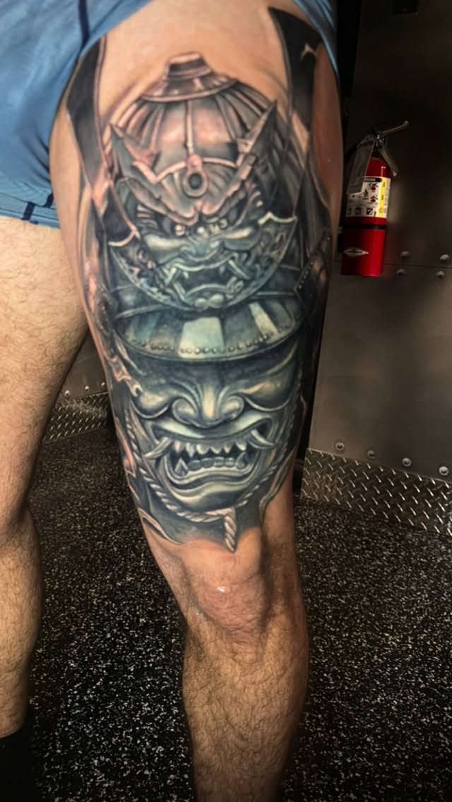 Grayscale oni mask leg-sleeve with armored detail.