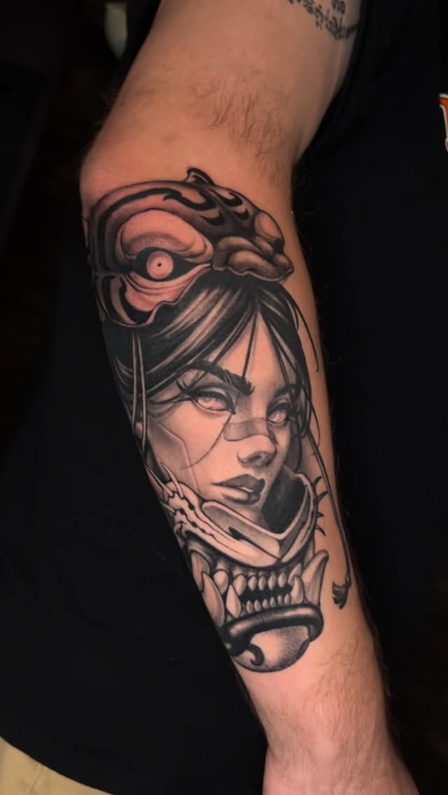 Dramatic black-and-gray femme portrait entwined with serpent