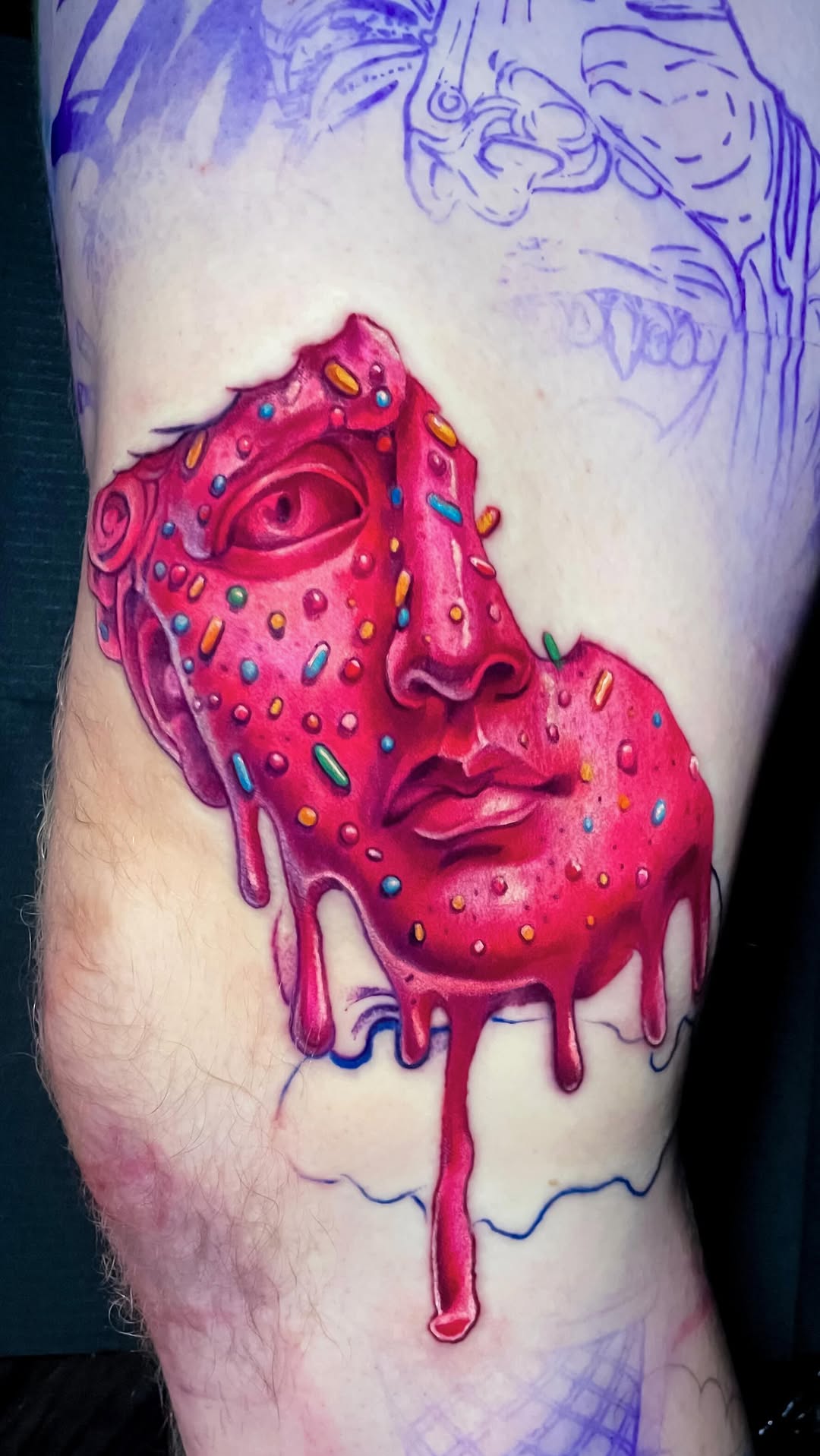 Candy-coated melting donut-face portrait with sprinkles.