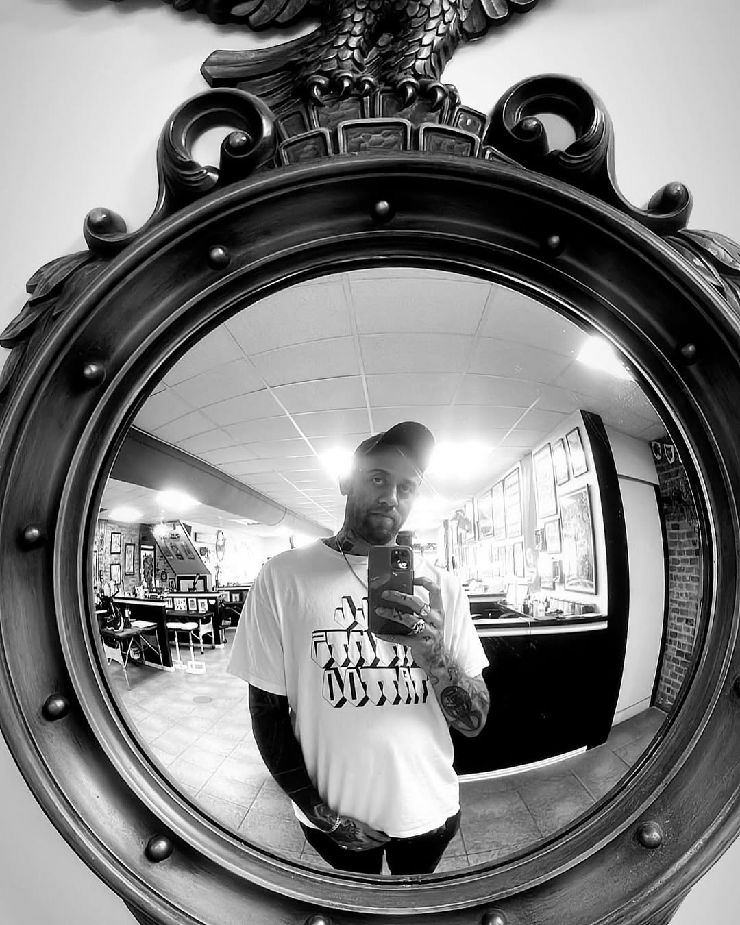 Bold blackwork forearm tattoo with geometric shapes