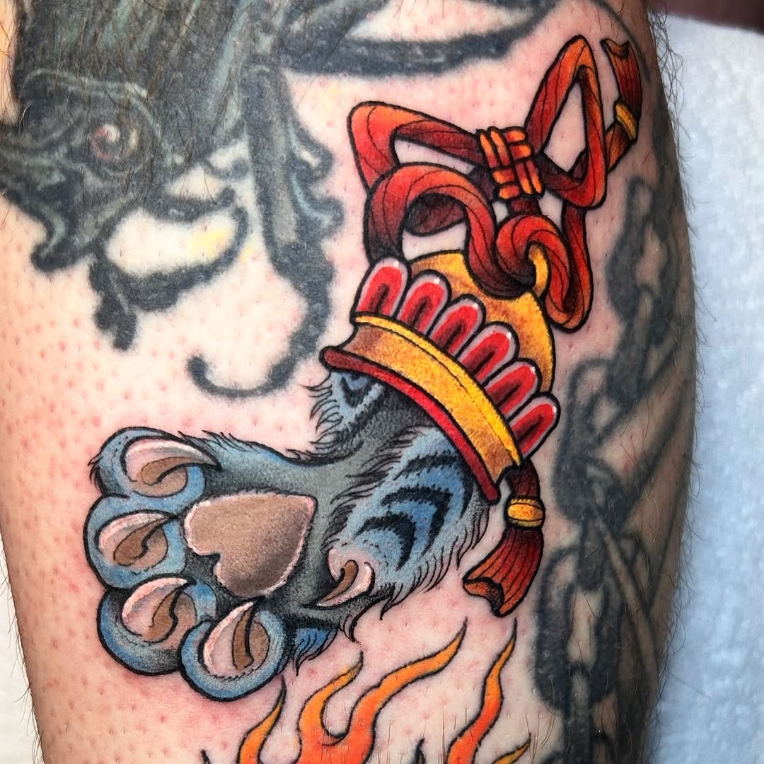 Bold neo-traditional beast paw wearing regal crown and plume