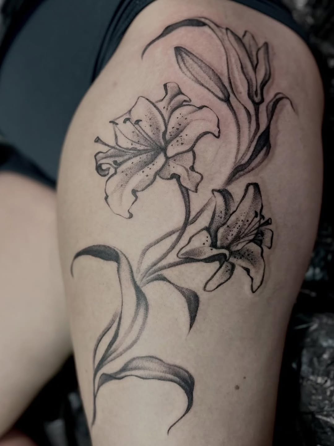 Elegant black-and-gray lily bouquet with flowing stems