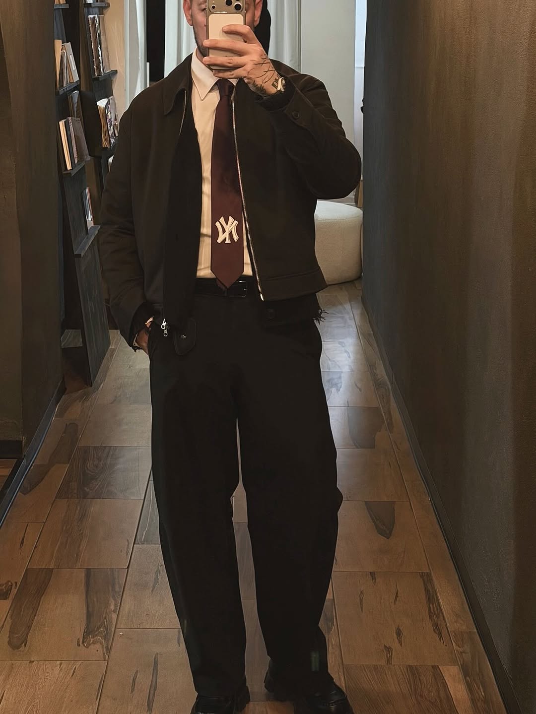 Minimal black micro-tattoo on the back of hand.