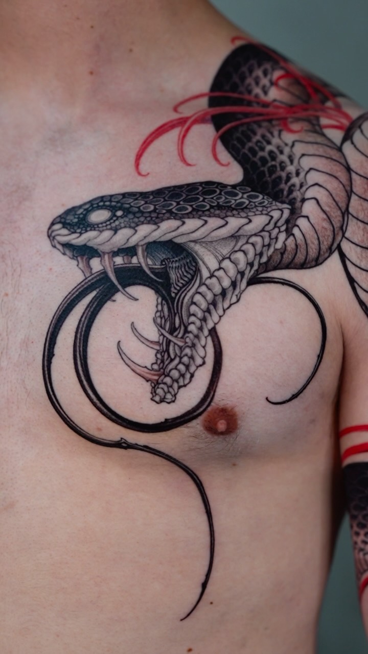 Ferocious blackwork cobra head with looping spirals