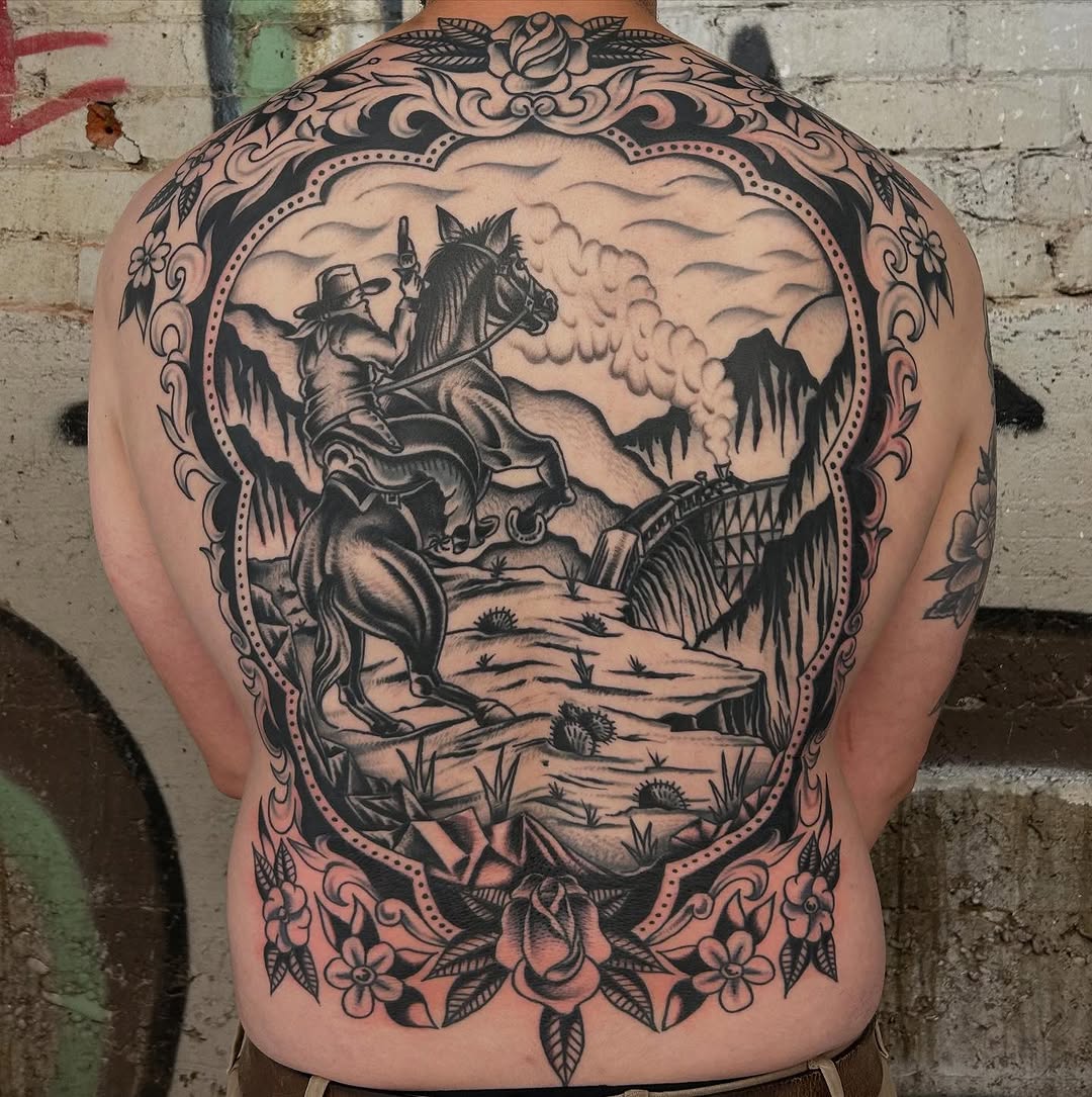 Bold black-and-gray western scene with rider framed by ornate border