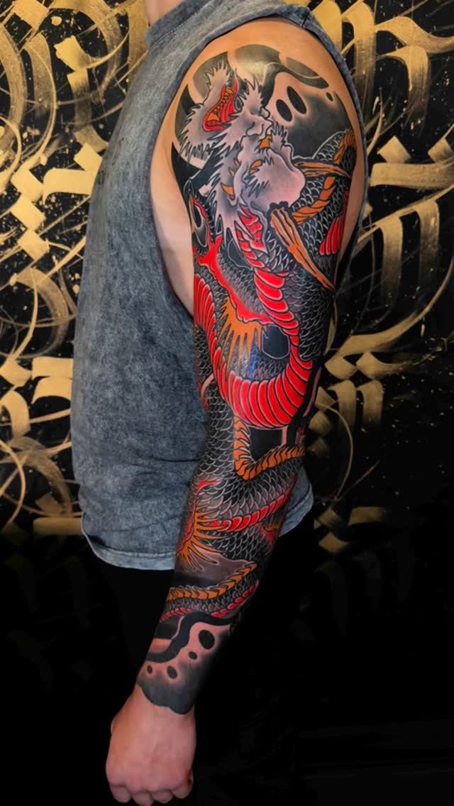 Vibrant Japanese dragon sleeve with bold scales and flames