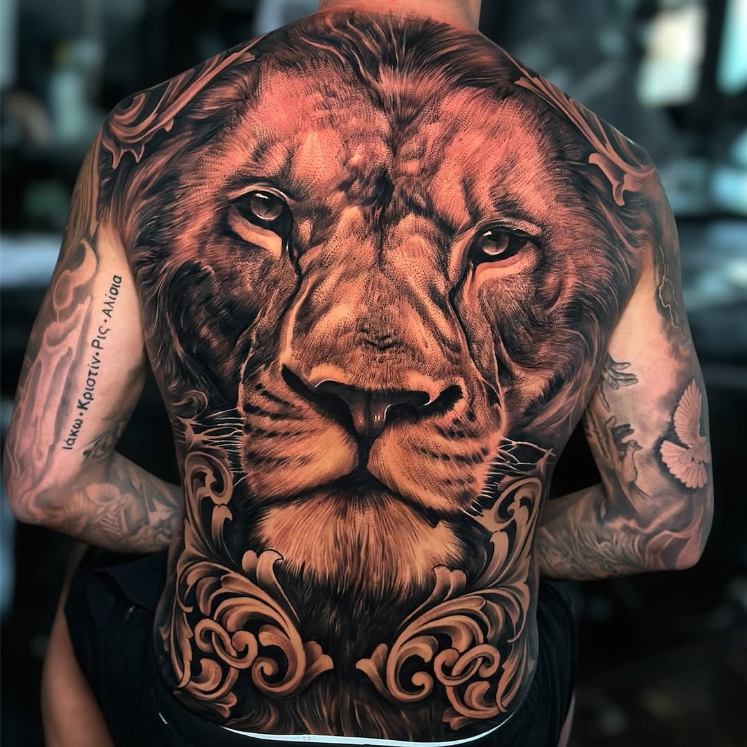 Majestic lion portrait with ornate blackwork filigree