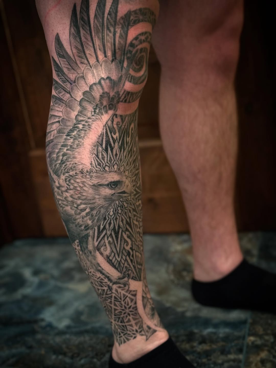 Intricate blackwork eagle with sacred geometry mandala