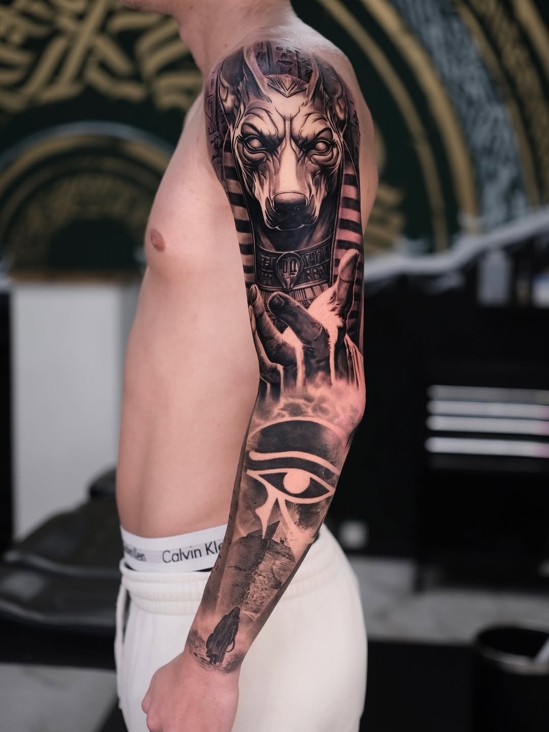 Monochrome Egyptian sleeve featuring Anubis head and Eye of Horus