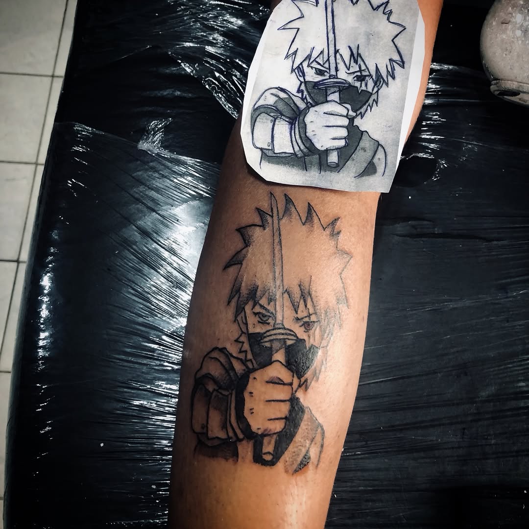 Kakashi-inspired Naruto forearm tattoo in bold black linework