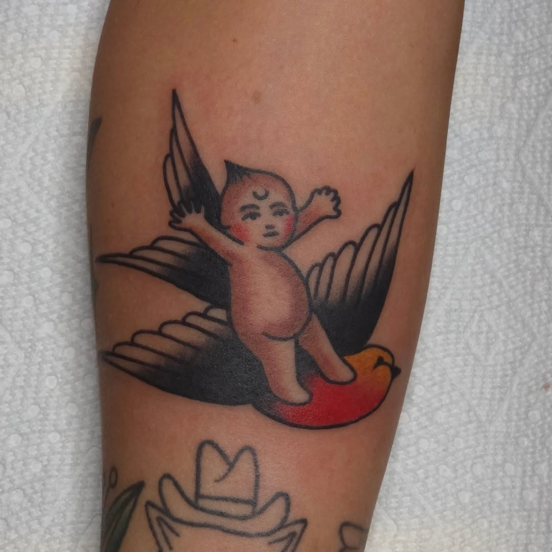 Whimsical cherub riding a bold flaming bird