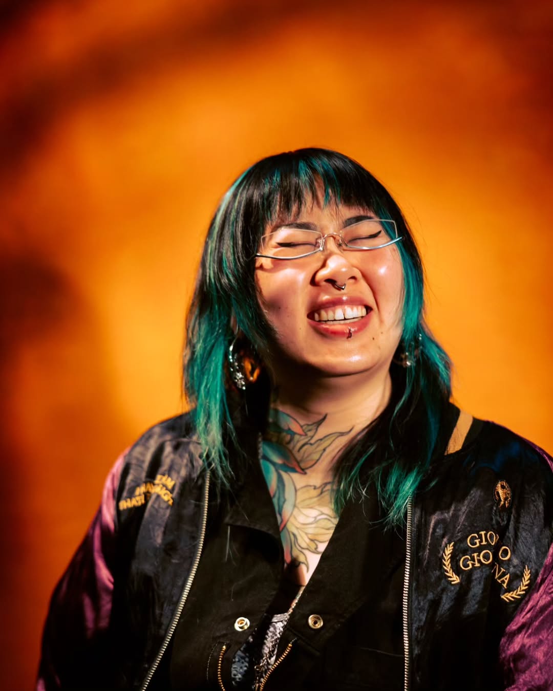 Vibrant botanical chest piece with teal-green leaves