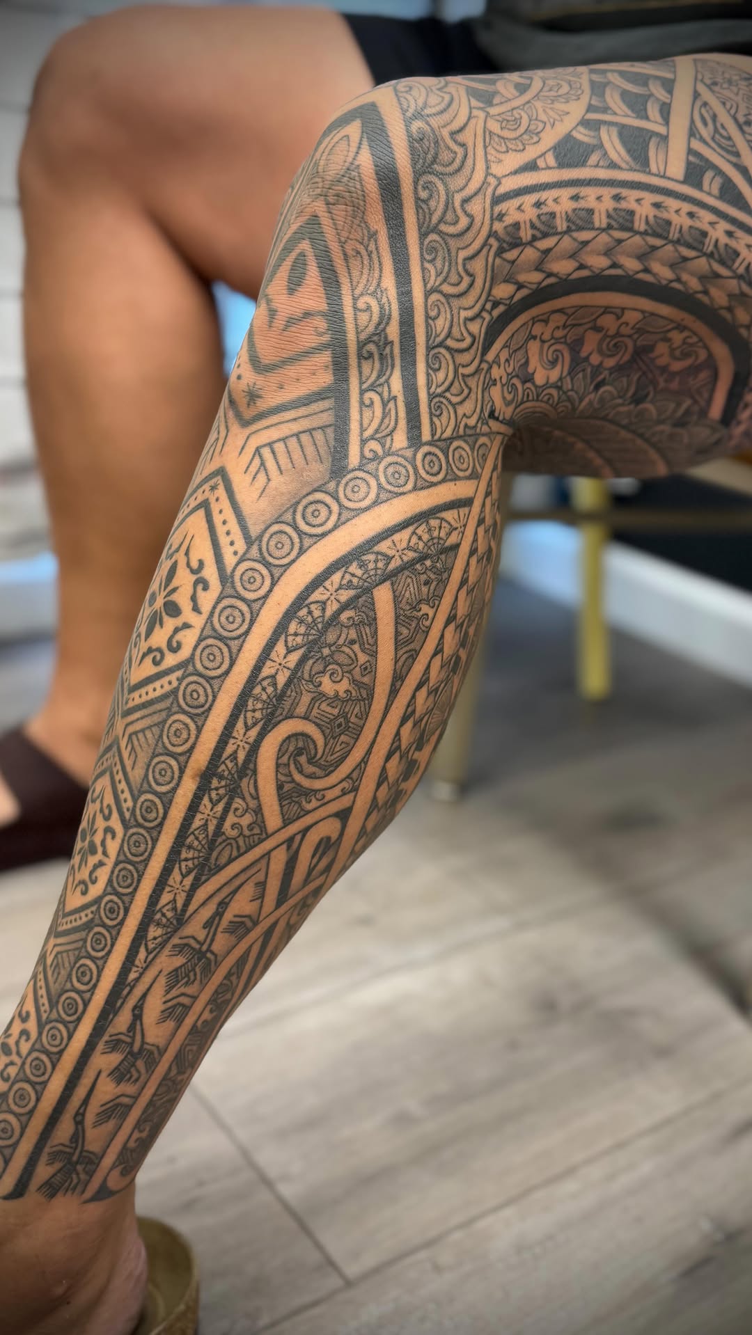 Intricate blackwork Polynesian leg sleeve with geometric motifs