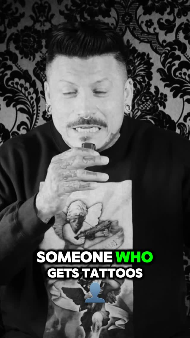 Bold blackwork tattoos across hands with dense linework