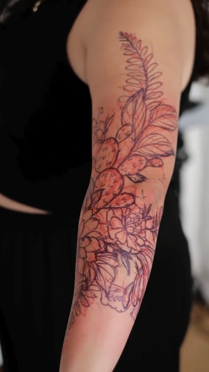 Delicate botanical forearm sleeve with blooming flowers and cactus