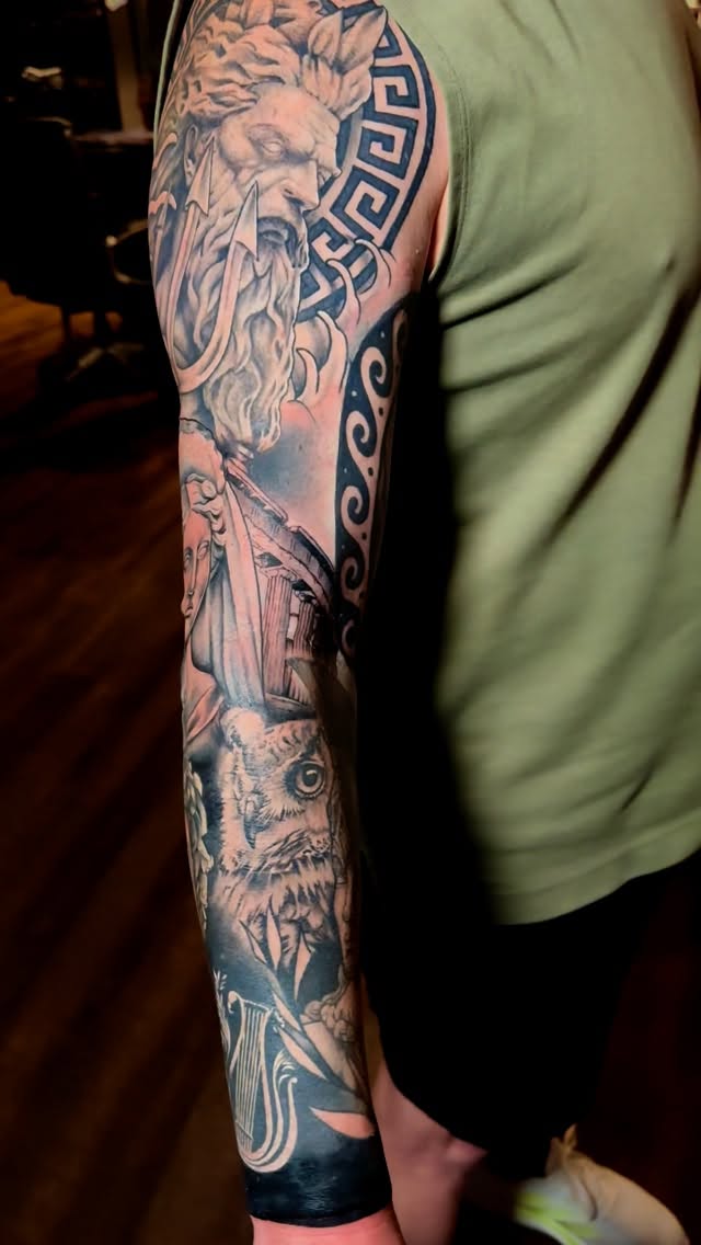 Monumental black-and-gray Greek statue sleeve with architecture