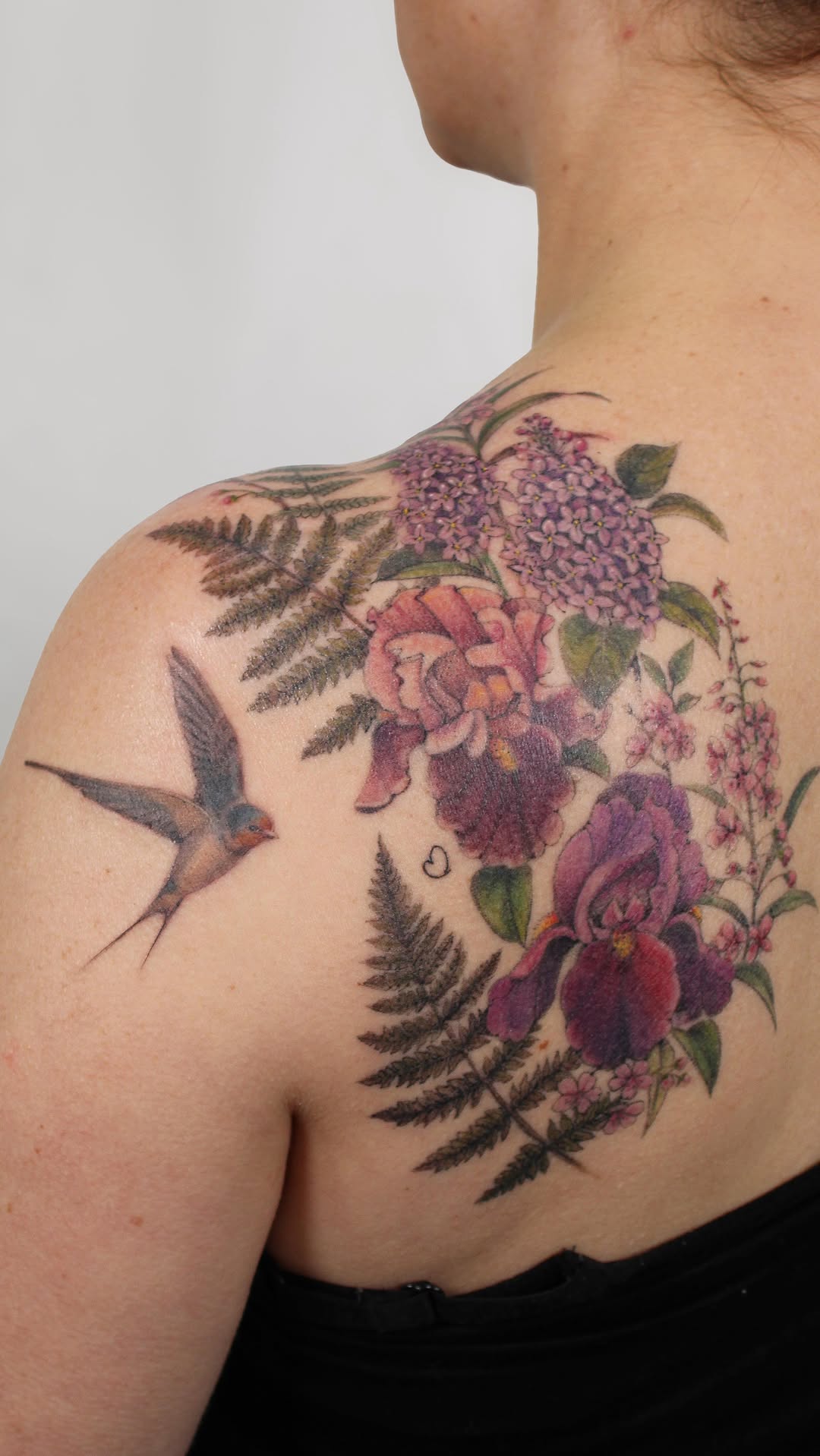 Vibrant floral back-shoulder piece with hummingbird