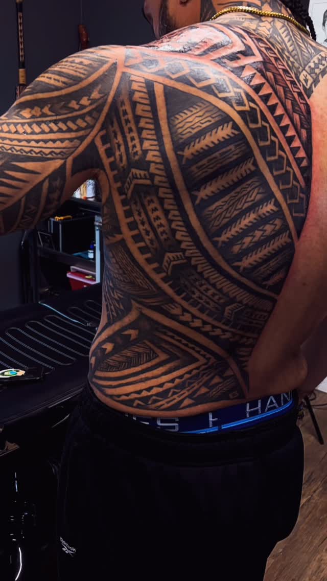Massive Polynesian tribal back piece in bold blackwork geometry