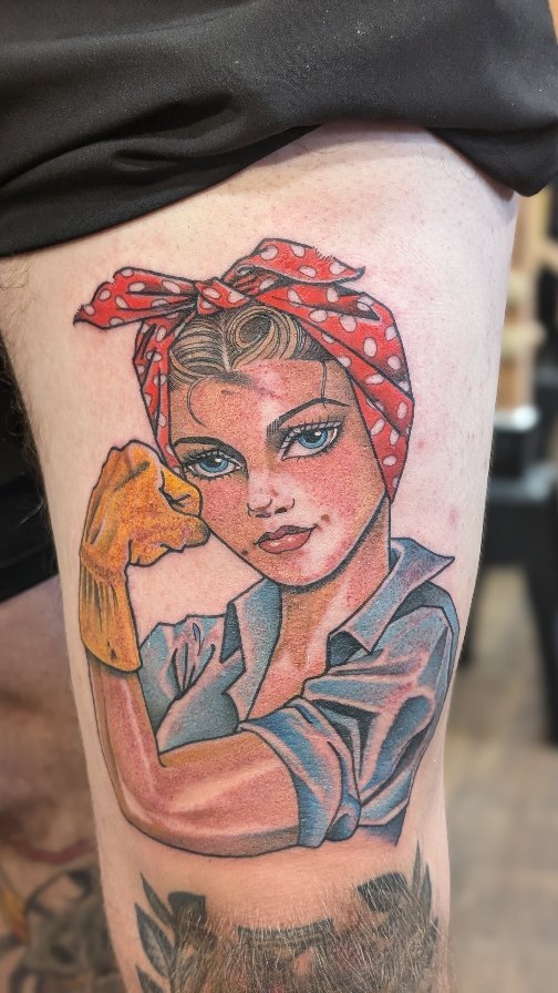 Rosie the Riveter pin-up in bold traditional style.