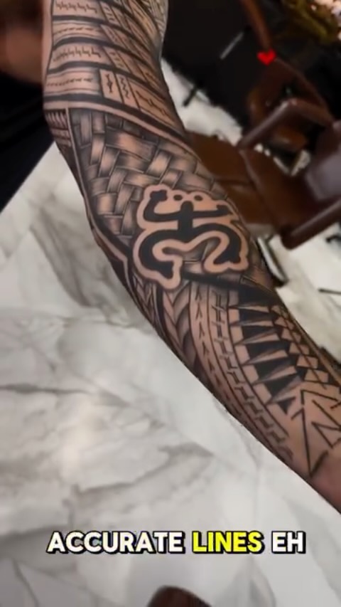 Bold Polynesian-Boricua fusion forearm sleeve with crisp lines